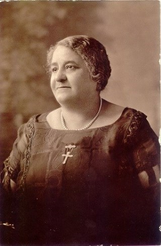 A sepia-toned photo of Maggie Lena Walker taken in the early 20th Century