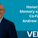 A photo of a smiling man in a blue jacket. Text: Honoring the Memory of B Lab Co-Founder Andrew Kassoy. Veris Wealth Partners logo.
