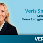 Title: Veris Spotlight: Senior Advisor Elena Ladygina. A photo of Elena, a smiling blonde woman in a dark blue suit.